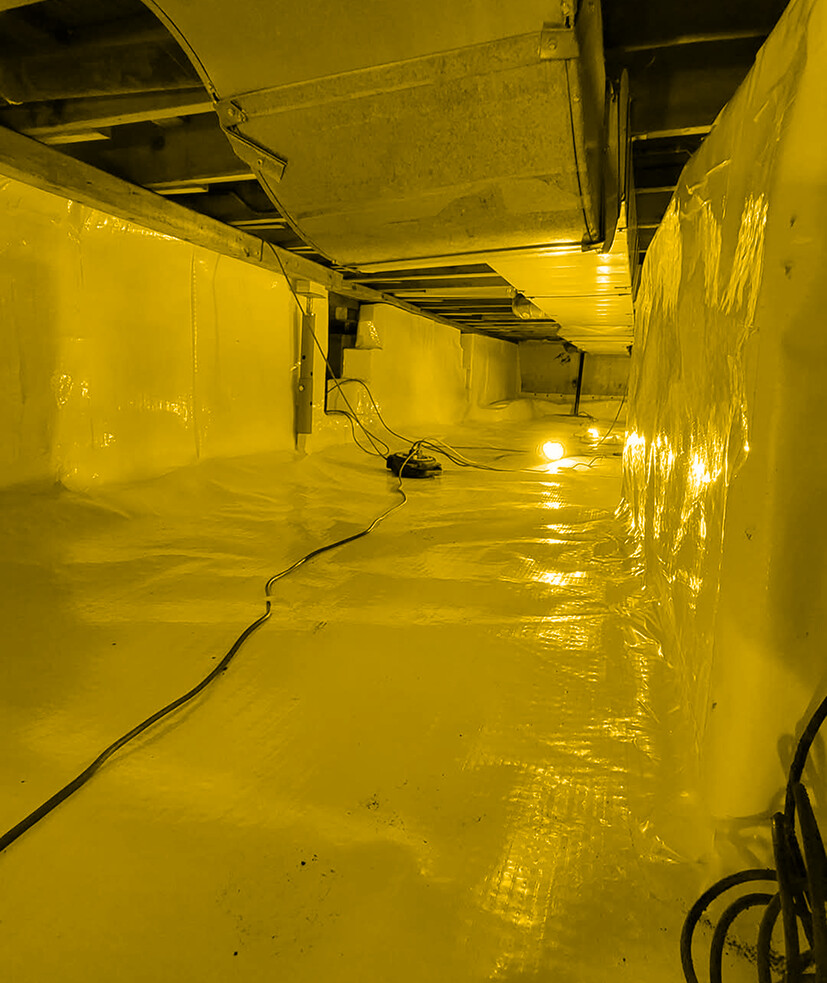 Professionally encapsulated crawl space with yellow vapor barrier
